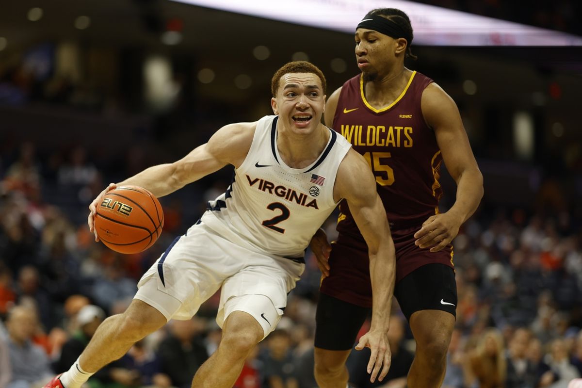 Dec 12, 2024; Charlottesville, Virginia, USA; Virginia Cavaliers forward Elijah Saunders (2) drives to the basket as Bethune-Cookman Wildcats forward Reggie Ward Jr. (15) defends in the second half at John Paul Jones Arena. Mandatory Credit: Geoff Burke-Imagn Images