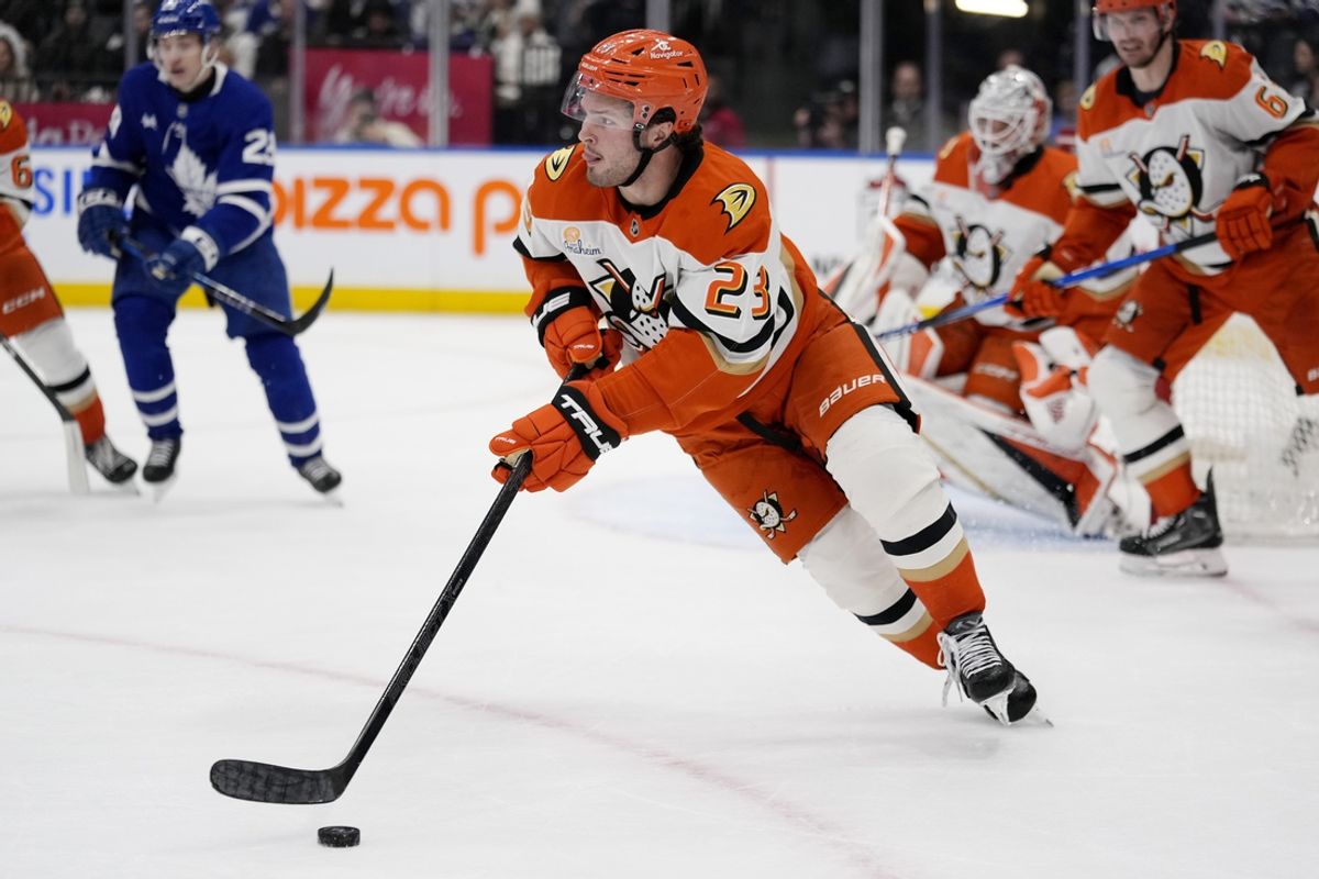 Dec 12, 2024; Toronto, Ontario, CAN; Anaheim Ducks forward Mason McTavish (23) carries the puck against the Toronto Maple Leafs during the third period at Scotiabank Arena. Mandatory Credit: John E. Sokolowski-Imagn Images