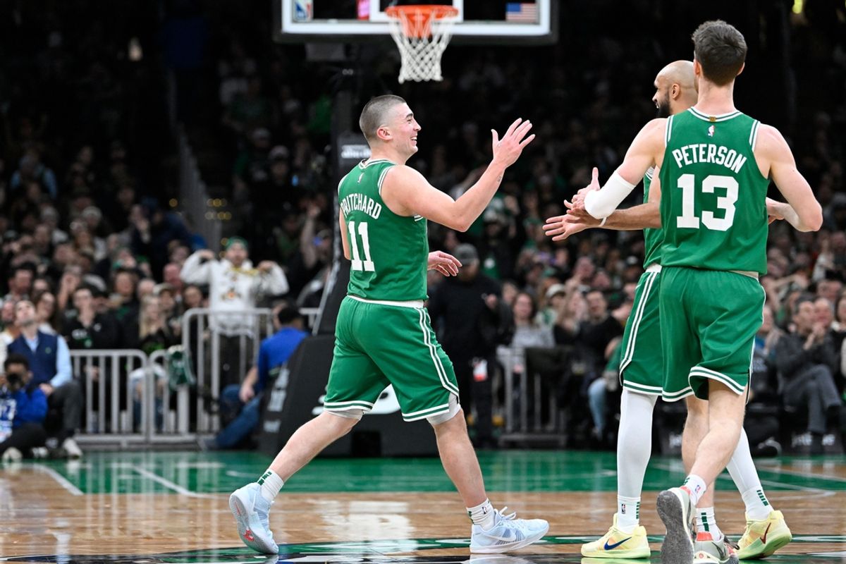 Dec 12, 2024; Boston, Massachusetts, USA; Boston Celtics guard Payton Pritchard (11) reacts to his three point basket against the Detroit Pistons during the second half at TD Garden. Mandatory Credit: Eric Canha-Imagn Images