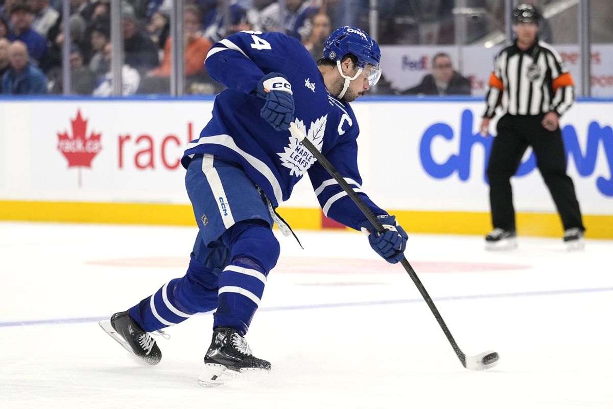 Dec 12, 2024; Toronto, Ontario, CAN; Toronto Maple Leafs forward Auston Matthews (34) shoots the puck against the Anaheim Ducks during the third period at Scotiabank Arena. Mandatory Credit: John E. Sokolowski-Imagn Images