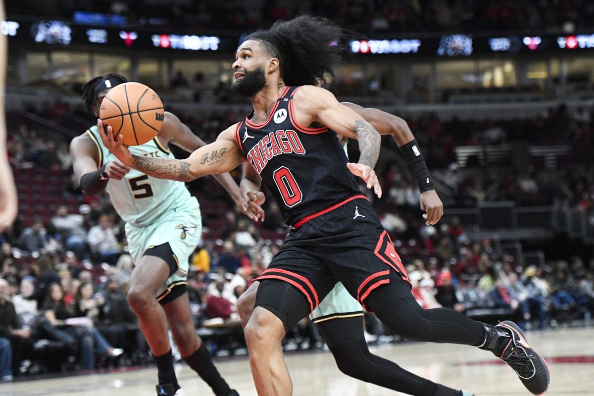Dec 13, 2024; Chicago, Illinois, USA;  Chicago Bulls guard Coby White (0) moves the ball against the4 Charlotte Hornets during the first half at the United Center. Mandatory Credit: Matt Marton-Imagn Images