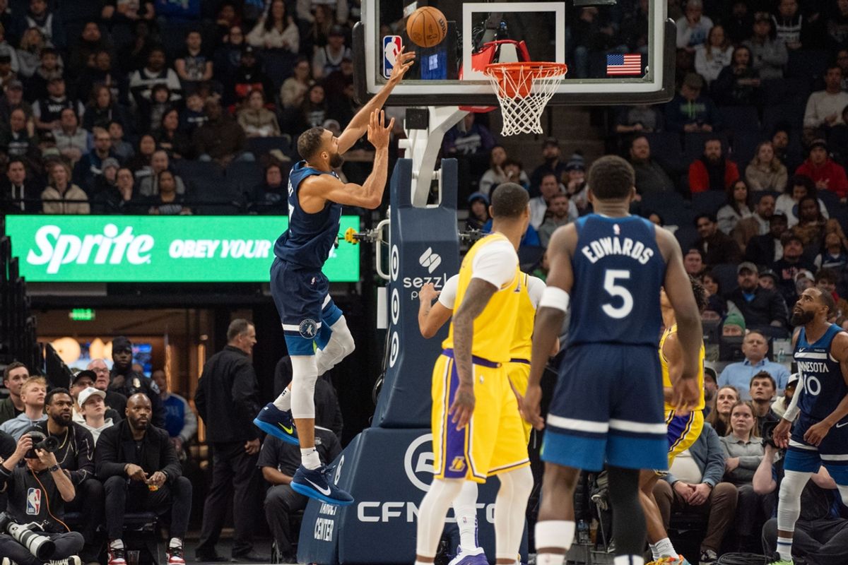 Dec 13, 2024; Minneapolis, Minnesota, USA; Minnesota Timberwolves center Rudy Gobert (27) shoots unguarded by the Los Angeles Lakers in the second quarter at Target Center. Mandatory Credit: Matt Blewett-Imagn Images