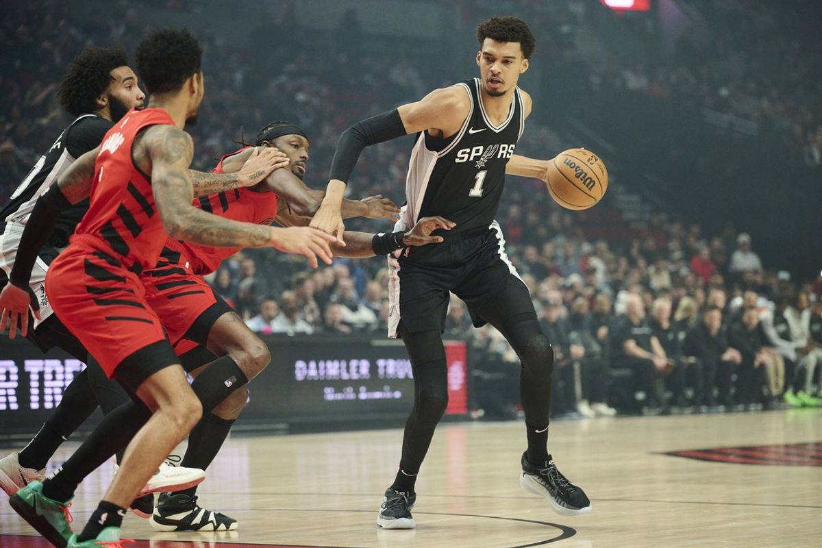 Dec 13, 2024; Portland, Oregon, USA; San Antonio Spurs center Victor Wembanyama (1) drives to the basket during the first half against Portland Trail Blazers forward Jerami Grant (9) at Moda Center. Mandatory Credit: Troy Wayrynen-Imagn Images