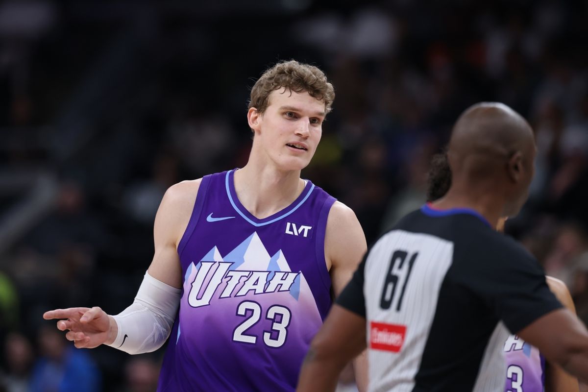 Dec 13, 2024; Salt Lake City, Utah, USA; Utah Jazz forward Lauri Markkanen (23) questions referee Courtney Kirkland (61) about a call for the Phoenix Suns during the second quarter at Delta Center. Mandatory Credit: Rob Gray-Imagn Images