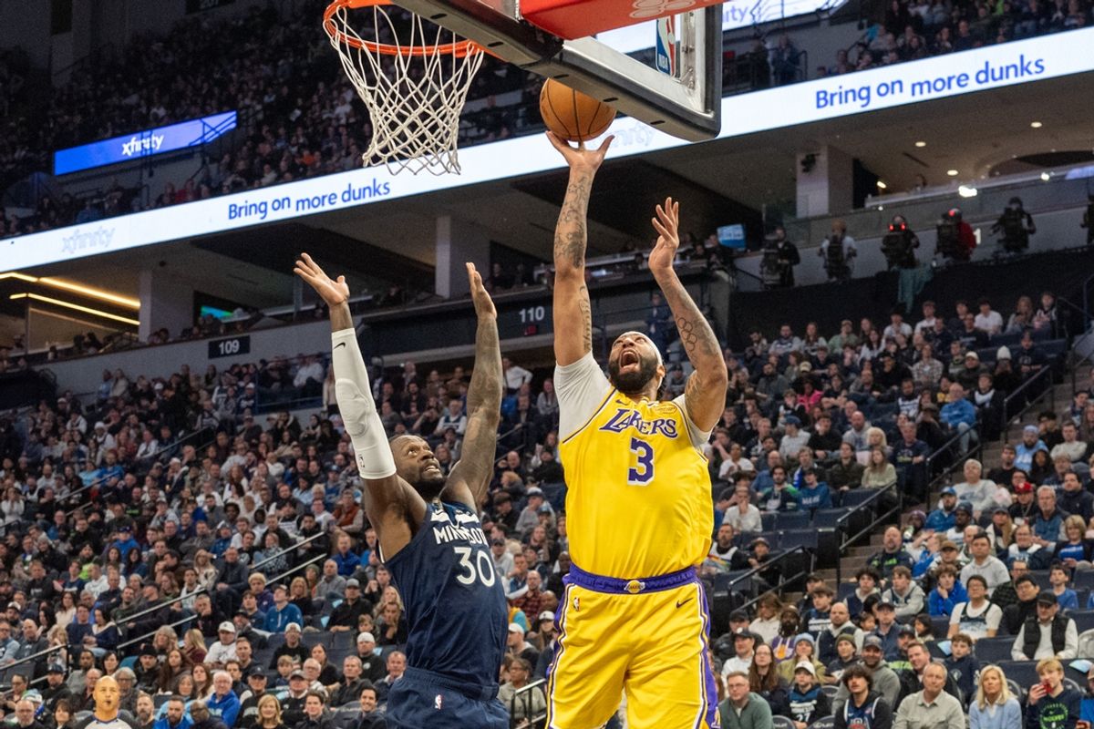 Dec 13, 2024; Minneapolis, Minnesota, USA; Los Angeles Lakers forward Anthony Davis (3) shoots over Minnesota Timberwolves forward Julius Randle (30) in the second quarter at Target Center. Mandatory Credit: Matt Blewett-Imagn Images