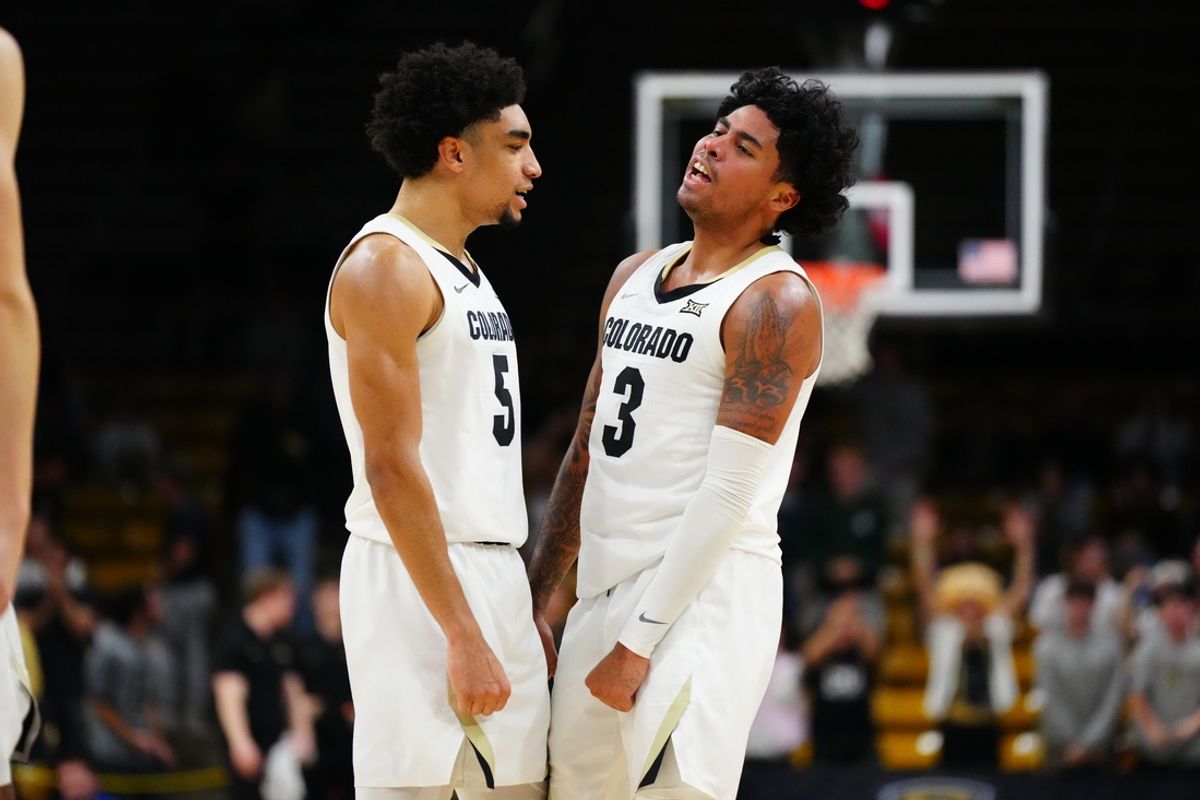 Dec 13, 2024; Boulder, Colorado, USA; Colorado Buffaloes guard RJ Smith (5) and guard Julian Hammond III (3) celebrate a three point basket in the second half against the South Dakota State Jackrabbits at CU Events Center. Mandatory Credit: Ron Chenoy-Imagn Images