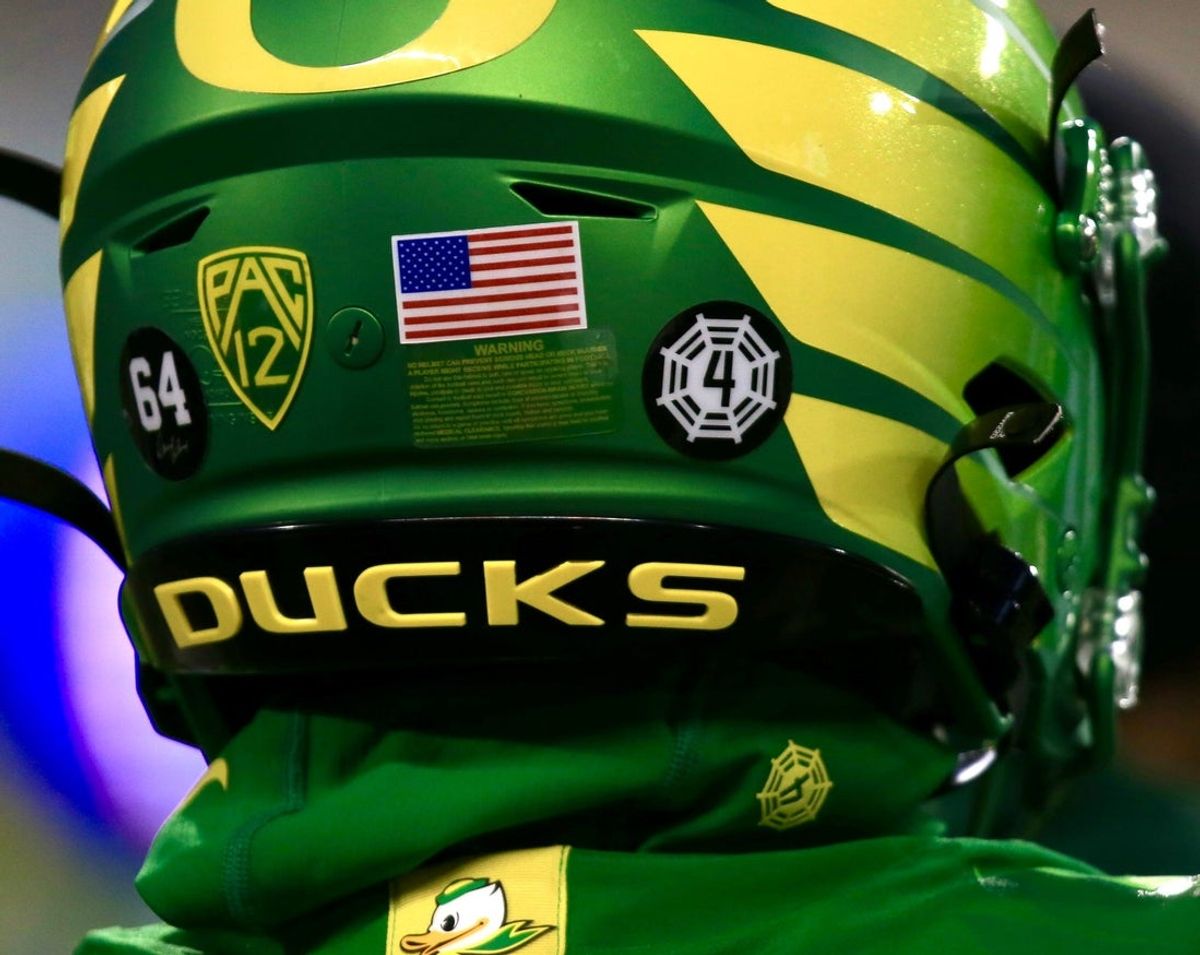 The team wears a tribute to Spencer Webb on their helmets in 2023.