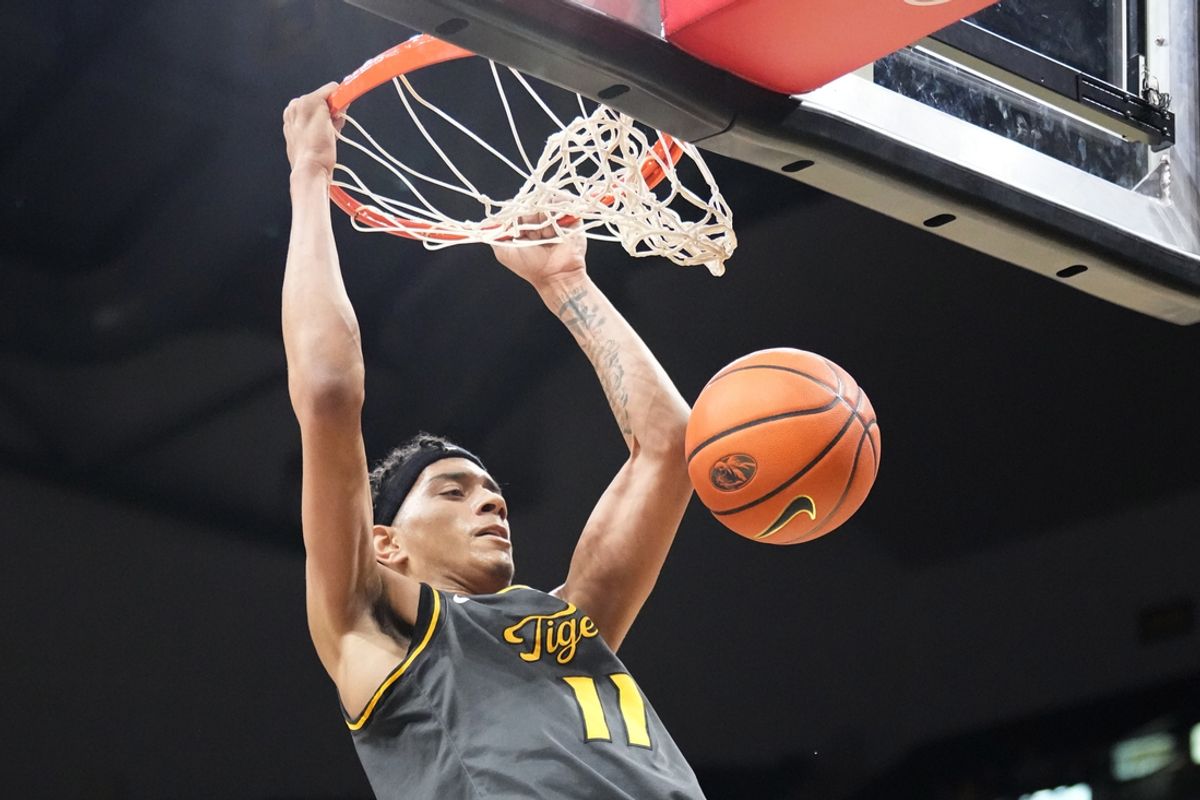 Dec 14, 2024; Columbia, Missouri, USA; Missouri Tigers guard Trent Pierce (11) dunks the ball against the LIU Sharks during the first half at Mizzou Arena. Mandatory Credit: Denny Medley-Imagn Images