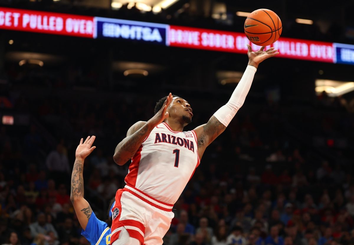 Dec 14, 2024; Phoenix, Arizona, USA; Arizona Wildcats guard Caleb Love (1) against the UCLA Bruins in the first half at Footprint Center. Mandatory Credit: Mark J. Rebilas-Imagn Images