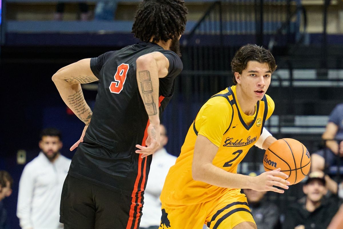 Dec 14, 2024; Berkeley, California, USA; California Golden Bears guard Andrej Stojakovic (2) dribbles the ball against Northwestern State Demons forward Addison Patterson (9) during the first half at Haas Pavilion. Mandatory Credit: Robert Edwards-Imagn Images