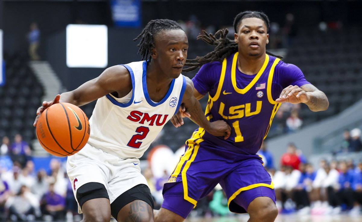 Dec 14, 2024; Frisco, Texas, USA;  Southern Methodist Mustangs guard Boopie Miller (2) drives to the basket as LSU Tigers guard Jordan Sears (1) defends during the first half at Comerica Center. Mandatory Credit: Kevin Jairaj-Imagn Images