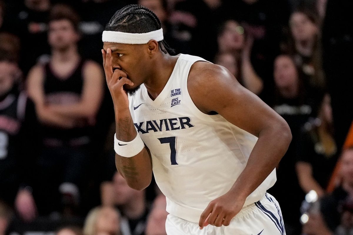 Xavier Musketeers guard Ryan Conwell (7) celebrates a three point basket in the second half of the 92nd Annual Crosstown Shootout NCAA basketball game between the Cincinnati Bearcats and the Xavier Musketeers at Fifth Third Arena on the UC campus in Cincinnati on Saturday, Dec. 14, 2024. The Bearcats won 68-65.