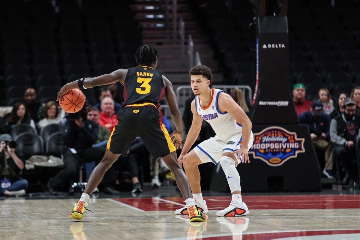 Dec 14, 2024; Atlanta, Georgia, USA; Florida Gators guard Walter Clayton Jr. (1) plays defense against Arizona State Sun Devils guard Joson Sanon (3) during the first half at State Farm Arena. Mandatory Credit: Jordan Godfree-Imagn Images