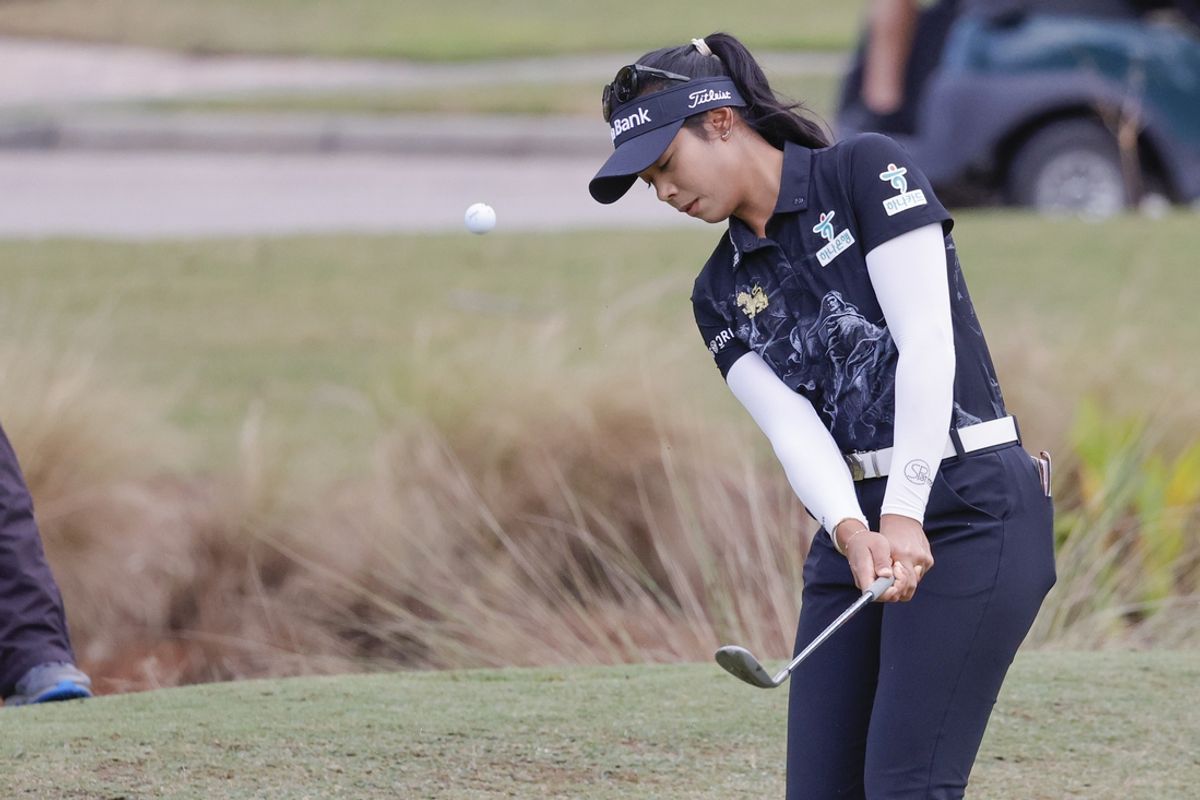 Dec 14, 2024; Naples, Florida, USA; Patty Tavatanakit chips onto the 12th green during the second round of the Grant Thornton Invitational at Tiburon Golf Club. Mandatory Credit: Reinhold Matay-Imagn Images