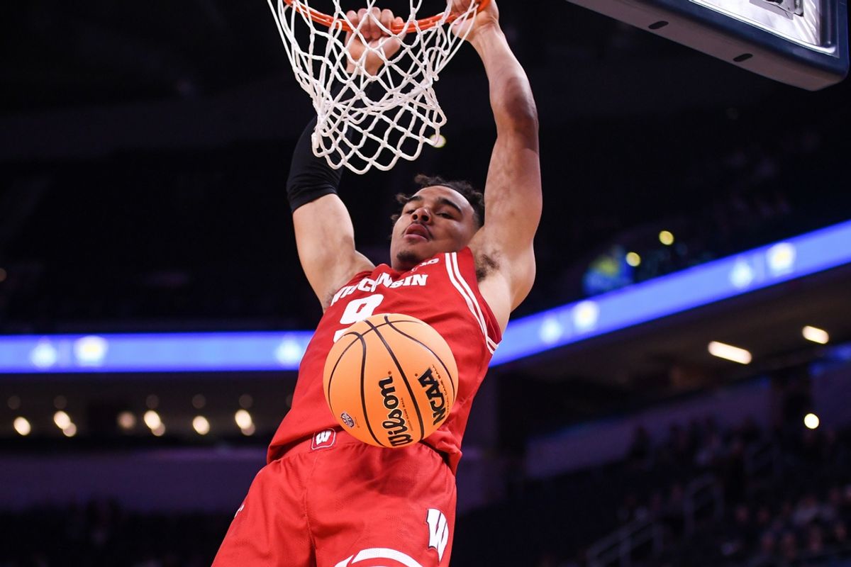 Dec 14, 2024; Indianapolis, Indiana, USA;  Wisconsin Badgers guard John Tonje (9) dunks the ball against the Butler Bulldogs during the second half at Gainbridge Fieldhouse. Mandatory Credit: Robert Goddin-Imagn Images
