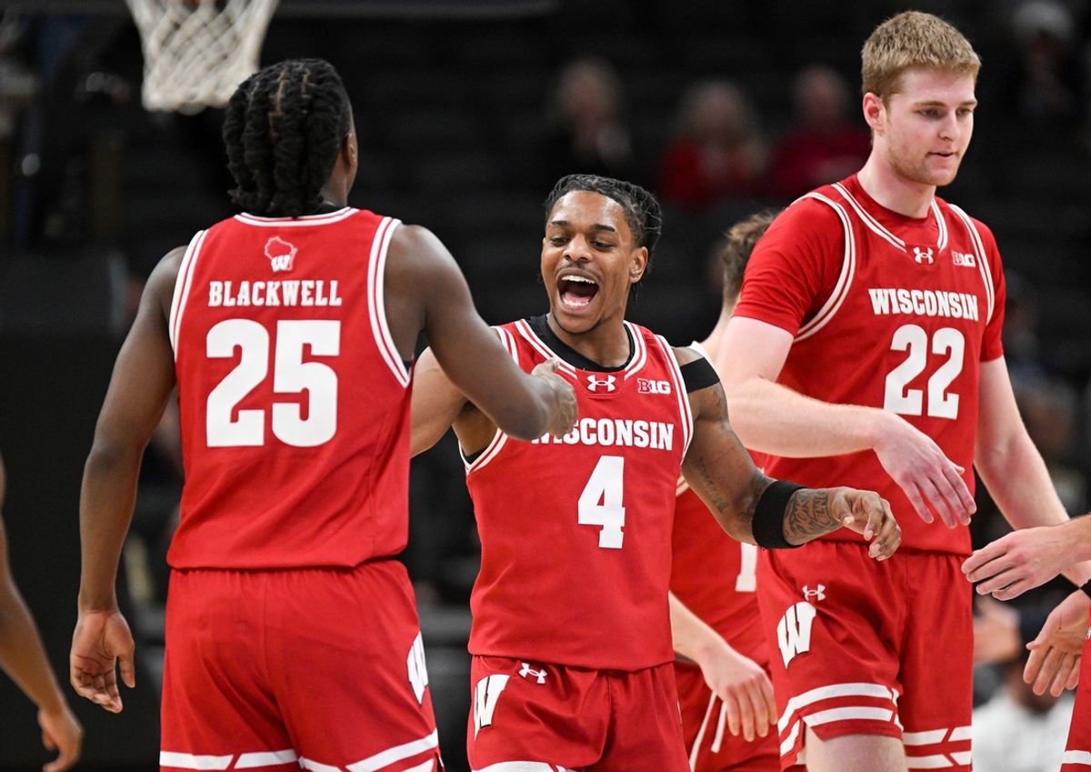 Dec 14, 2024; Indianapolis, Indiana, USA;  Wisconsin Badgers guards John Blackwell (25) and Kamari McGee (4) celebrate after a play during the second half against the Butler Bulldogs at Gainbridge Fieldhouse. Mandatory Credit: Robert Goddin-Imagn Images