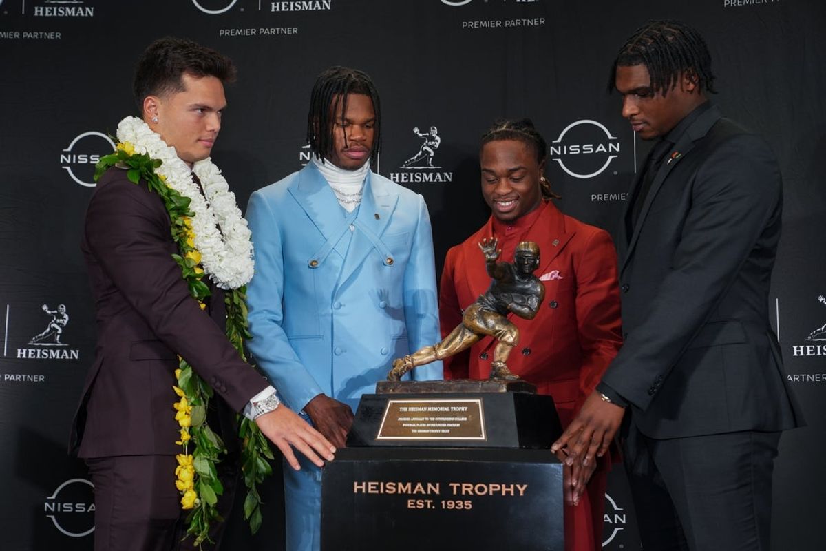 Heisman Trophy winner Colorado Buffaloes wide receiver/cornerback Travis Hunter, Boise State Broncos running back Ashton Jeanty and Miami Hurricanes quarterback Cam Ward pose for a photo during a press conference before the 2024 Heisman Trophy Presentation. Mandatory Credit: Lucas Boland-Imagn Images