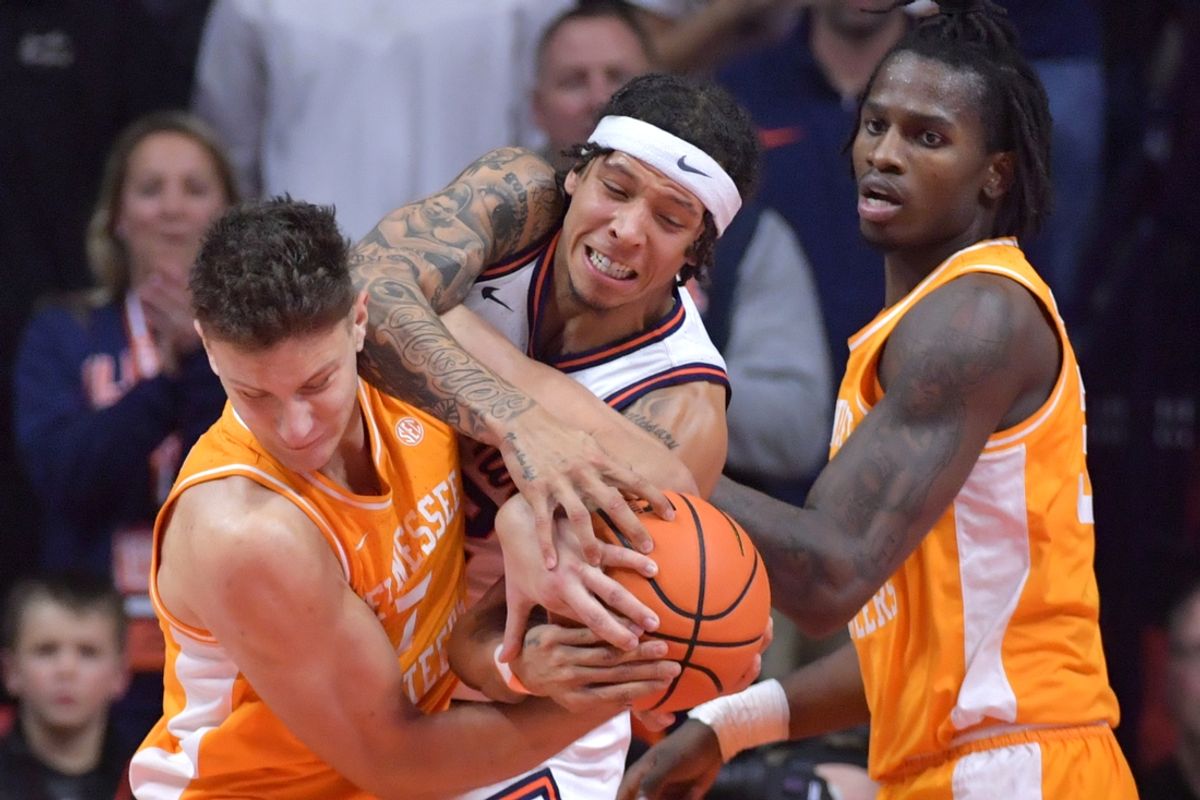 Dec 14, 2024; Champaign, Illinois, USA;  Tennessee Volunteers forward Igor Milicic (7) and Illinois Fighting Illini guard Tre White (22) wrestle for the ball during the first half at State Farm Center. Mandatory Credit: Ron Johnson-Imagn Images