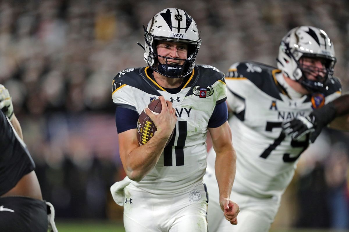 Dec 14, 2024; Landover, Maryland, USA; Navy Midshipmen quarterback Blake Horvath (11) carries the ball against the Army Black Knights during the second half of the the 125th Army-Navy game at Northwest Stadium. Mandatory Credit: Danny Wild-Imagn Images