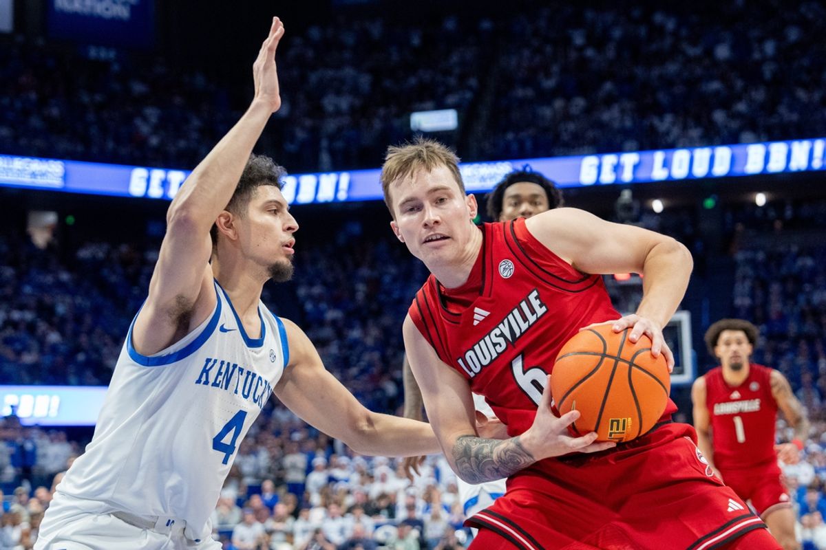 Louisville Cardinals guard Reyne Smith (6) attempts to make it to the basket against Kentucky Wildcats guard Koby Brea (4) during their game on Saturday, Dec. 14, 2024 at Rupp Arena in Lexington, Ky.
