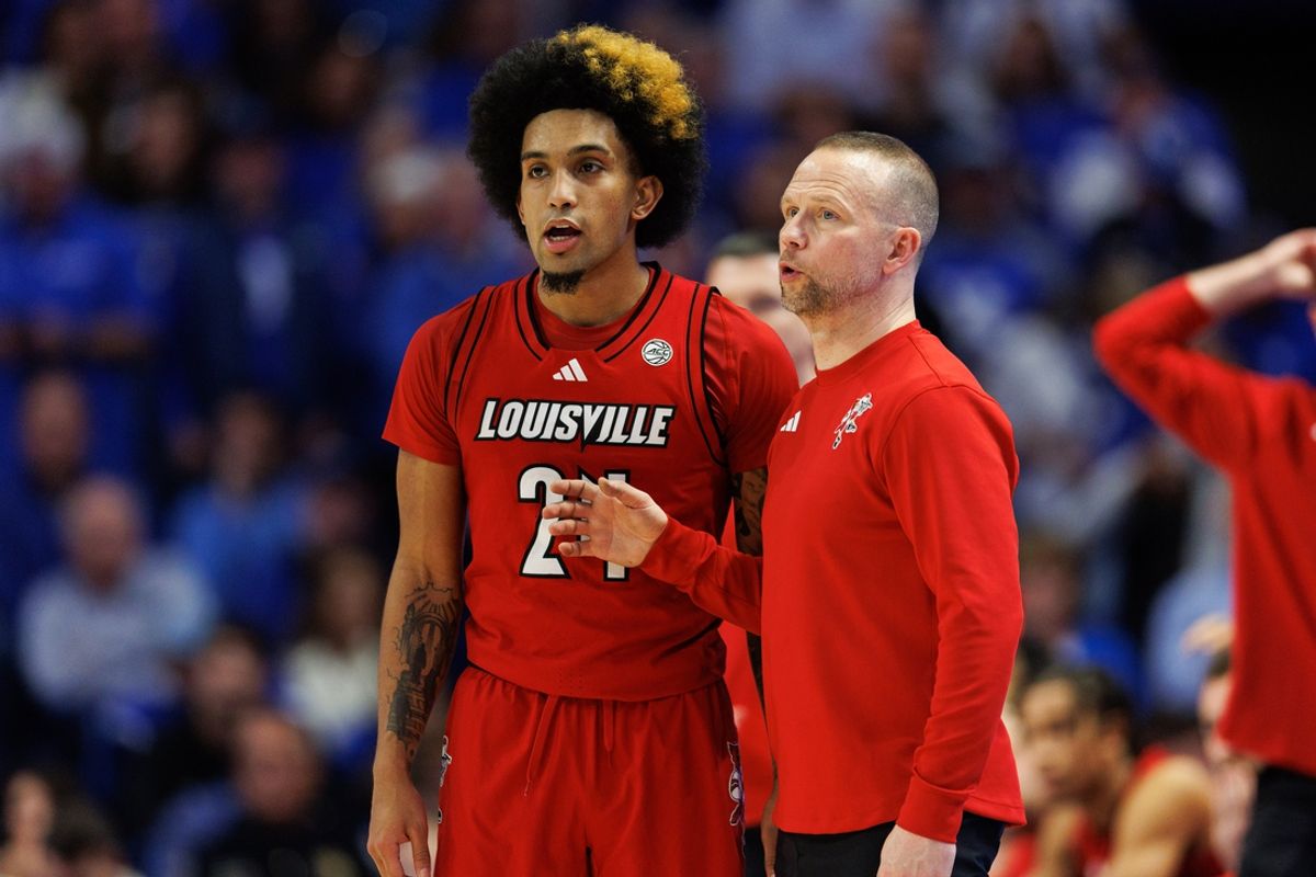 Dec 14, 2024; Lexington, Kentucky, USA; Louisville Cardinals head coach Pat Kelsey talks to guard Chucky Hepburn (24) during the second half against the Kentucky Wildcats at Rupp Arena at Central Bank Center. Mandatory Credit: Jordan Prather-Imagn Images