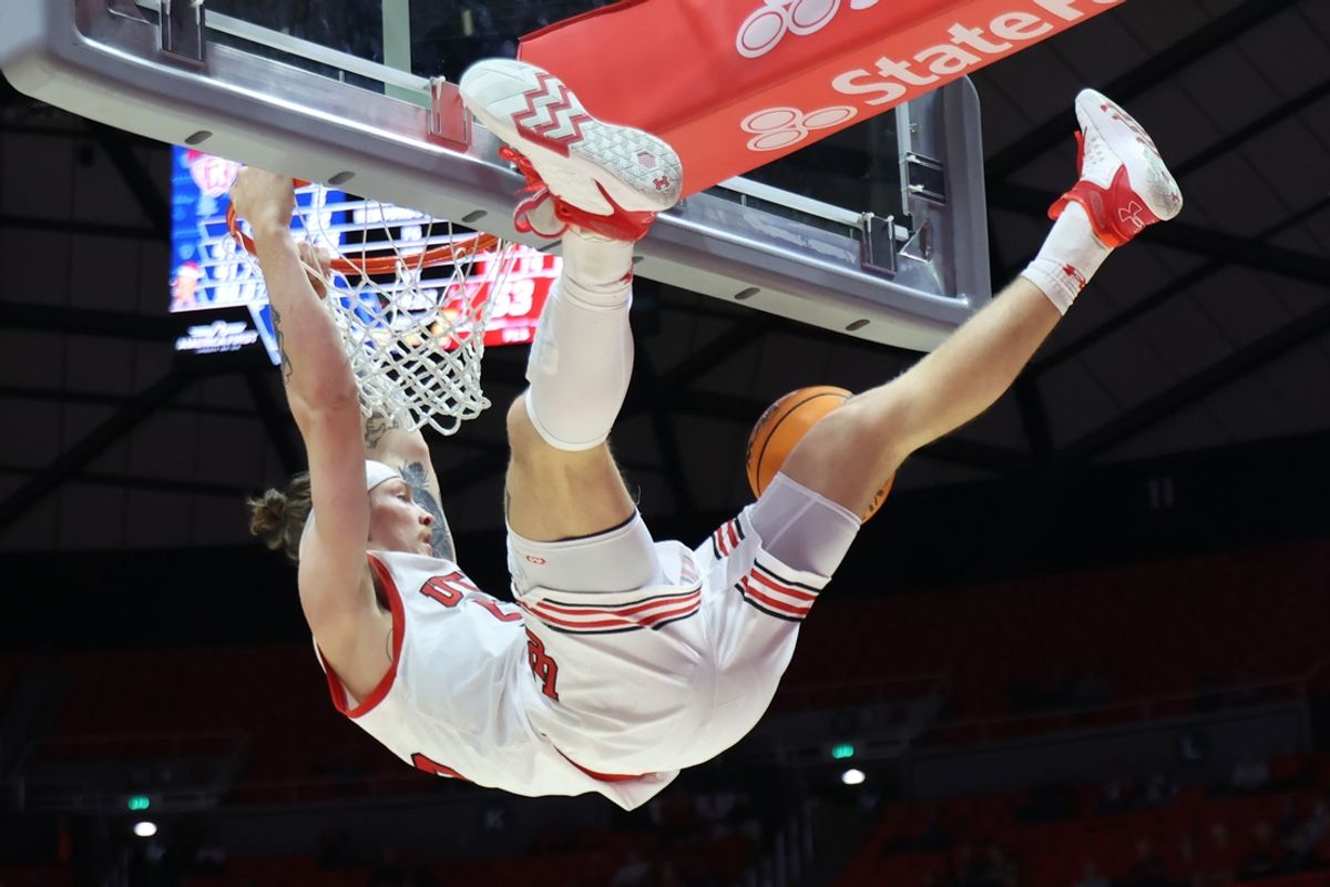 Dec 14, 2024; Salt Lake City, Utah, USA; Utah Utes guard Gabe Madsen (55) dunks the ball against the Radford Highlanders during the second half at Jon M. Huntsman Center. Mandatory Credit: Rob Gray-Imagn Images