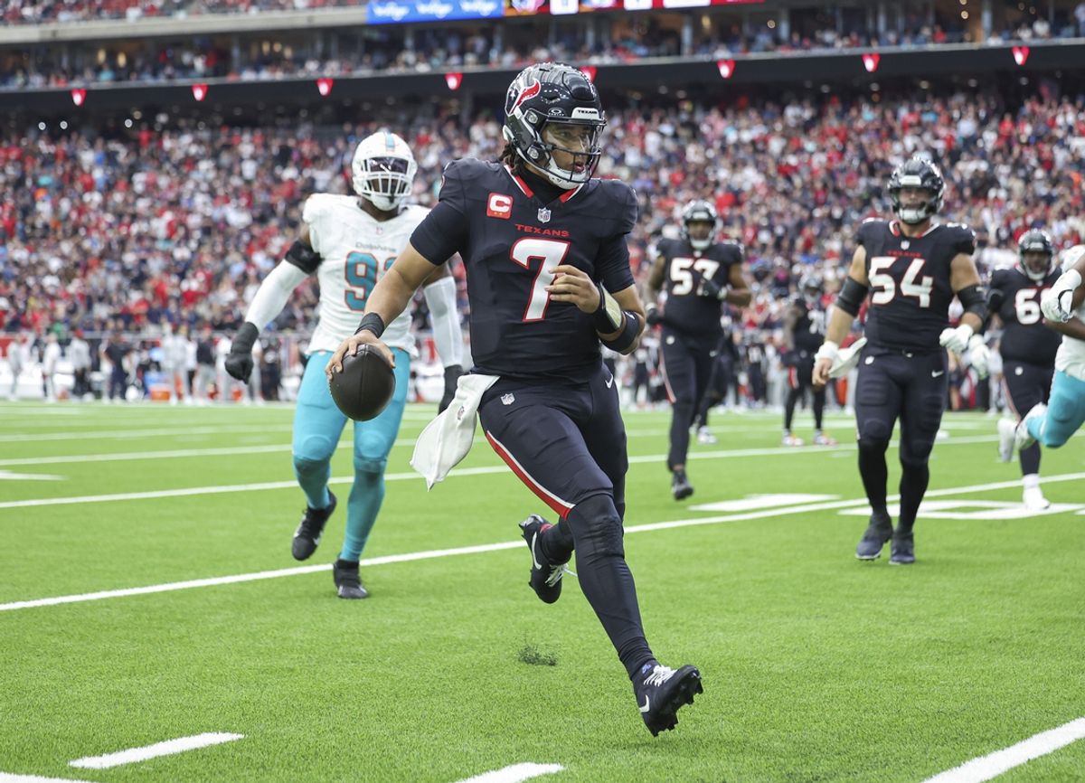 Dec 15, 2024; Houston, Texas, USA; Houston Texans quarterback C.J. Stroud (7) runs with the ball during the second quarter against the Miami Dolphins at NRG Stadium. Mandatory Credit: Troy Taormina-Imagn Images