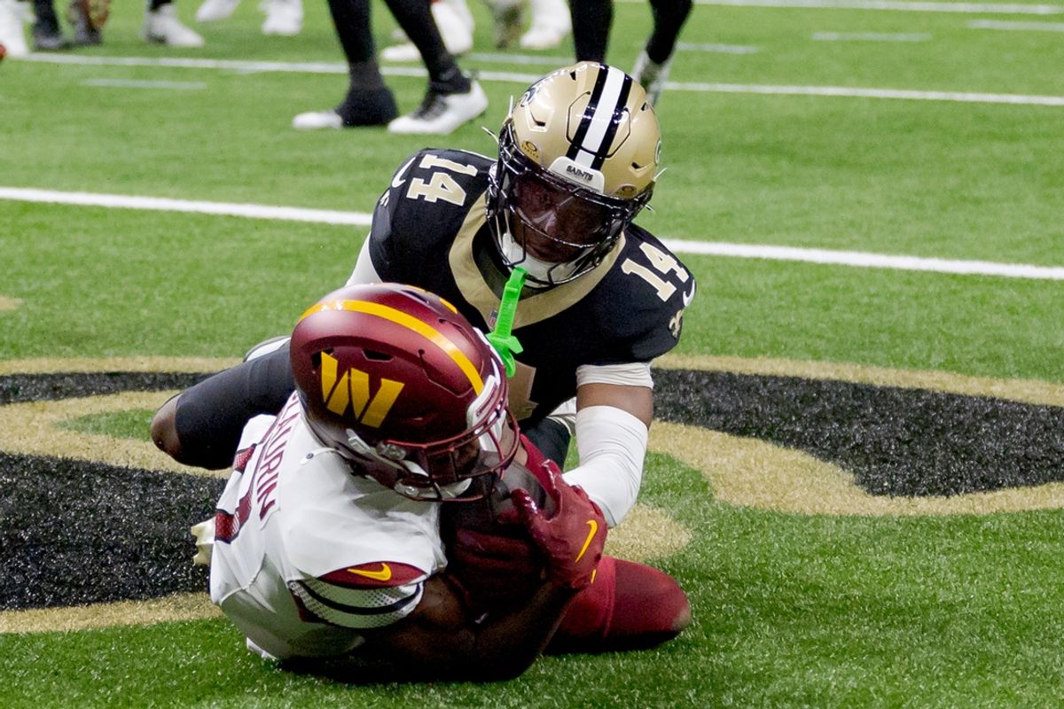 Dec 15, 2024; New Orleans, Louisiana, USA;  Washington Commanders wide receiver Terry McLaurin (17) makes a touchdown against the New Orleans Saints cornerback Kool-Aid McKinstry (14) during the first half at Caesars Superdome. Mandatory Credit: Matthew Hinton-Imagn Images