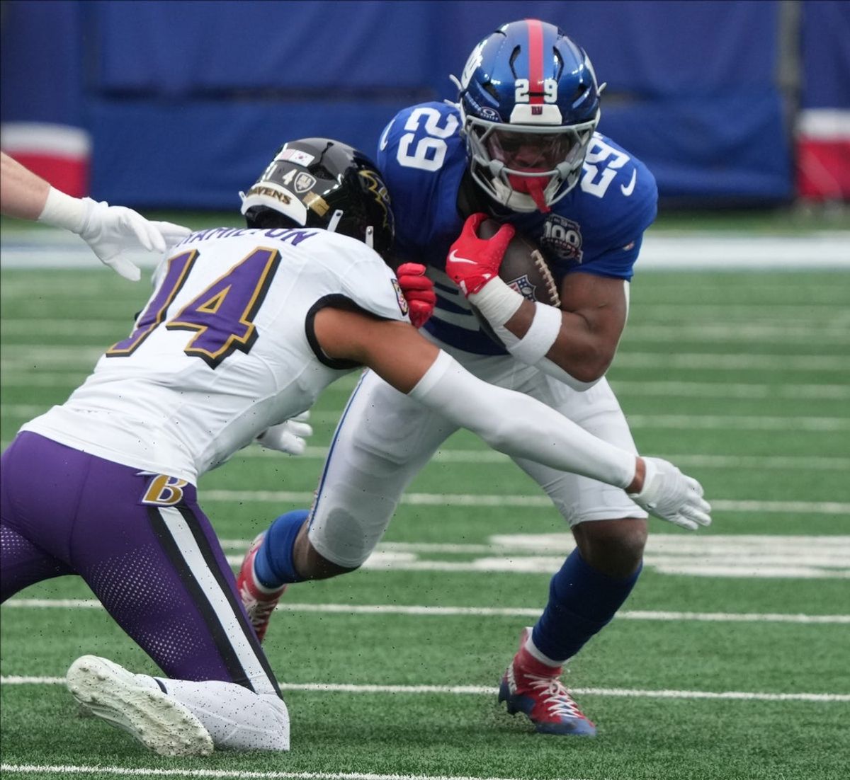 East Rutherford, NJ -- December 15, 2024 -- Kyle Hamilton of the Ravens and Tyrone Tracy Jr. of the Giants in the first half. The Baltimore Ravens came to MetLife Stadium to play the New York Giants.