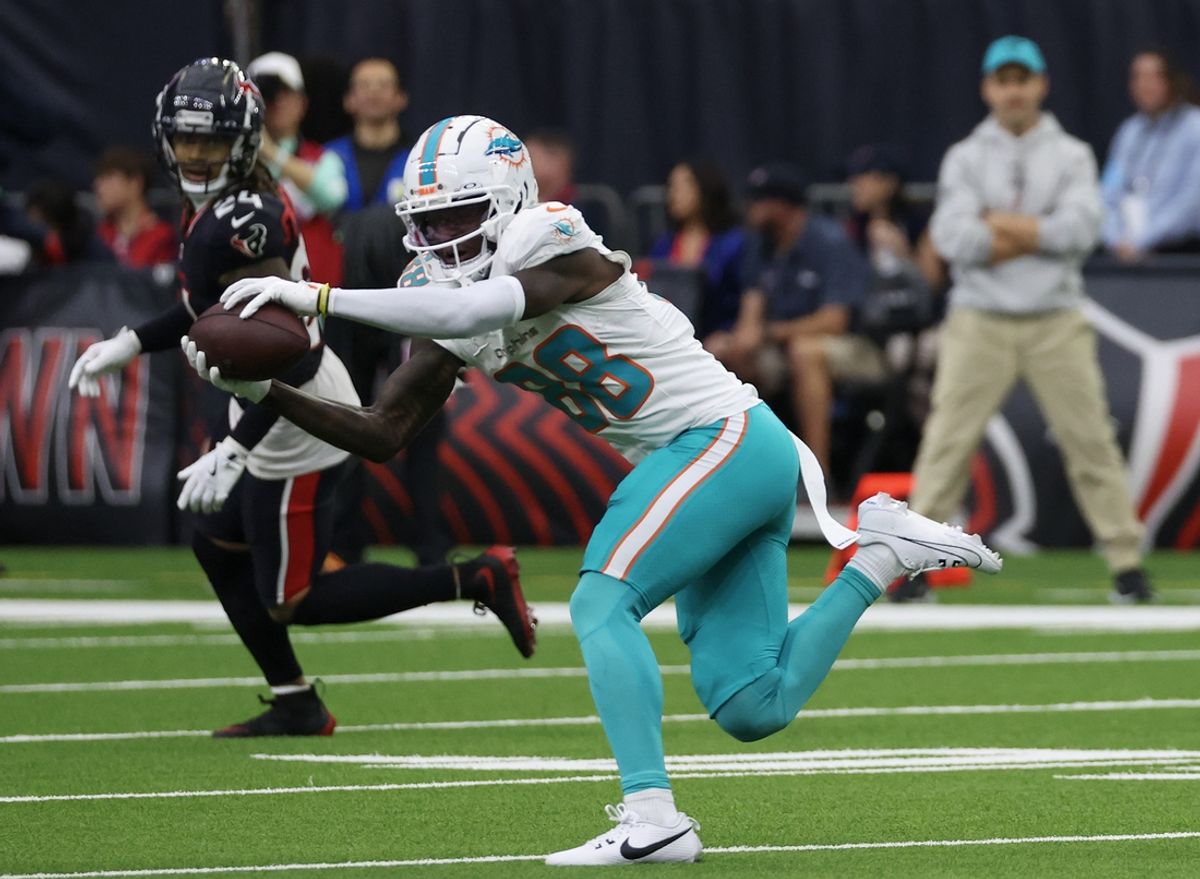 Dec 15, 2024; Houston, Texas, USA;  Miami Dolphins wide receiver Grant DuBose (88) makes a catch against the Houston Texans in the third quarter at NRG Stadium. Mandatory Credit: Thomas Shea-Imagn Images