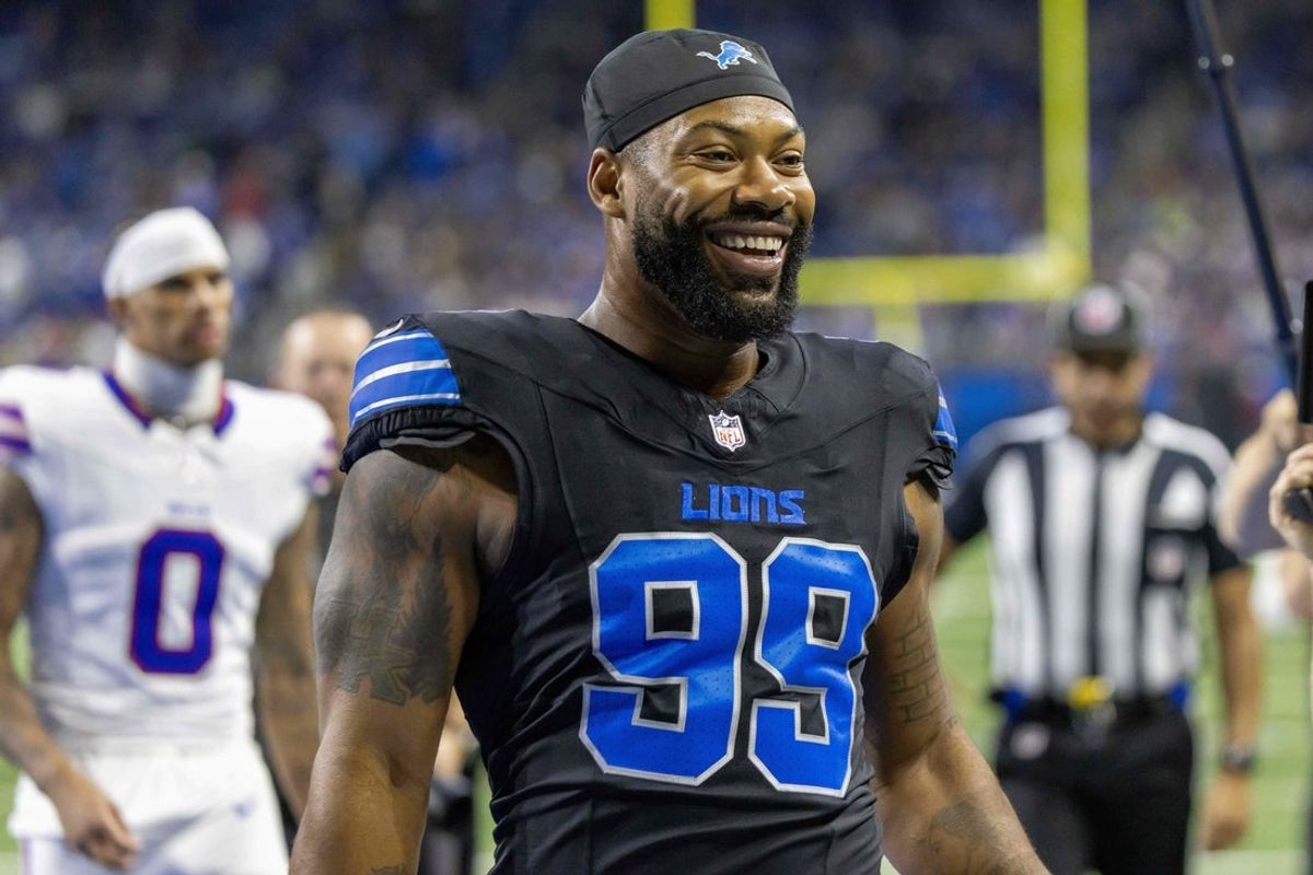 Dec 15, 2024; Detroit, Michigan, USA; Detroit Lions defensive end Za'Darius Smith (99) walks off the field after warm ups before a game against the Buffalo Bills at Ford Field. Mandatory Credit: David Reginek-Imagn Images