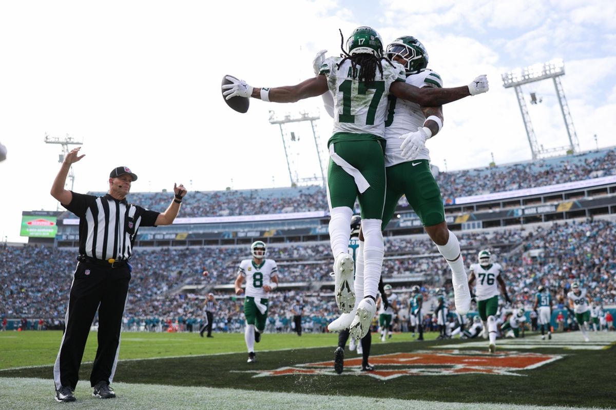 Dec 15, 2024; Jacksonville, Florida, USA; New York Jets wide receiver Davante Adams (17) celebrates with running back Braelon Allen (0) after scoring a touchdown against the Jacksonville Jaguars in the third quarter at EverBank Stadium. Mandatory Credit: Nathan Ray Seebeck-Imagn Images
