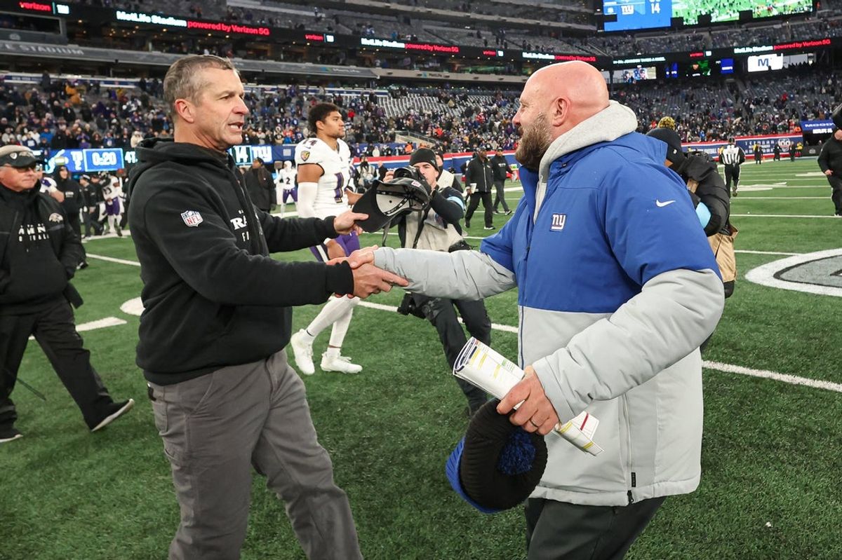 Dec 15, 2024; East Rutherford, New Jersey, USA; Baltimore Ravens head coach John Harbaugh, left, shakes hands with New York Giants head coach Brian Daboll  after the game at MetLife Stadium. Mandatory Credit: Vincent Carchietta-Imagn Images
