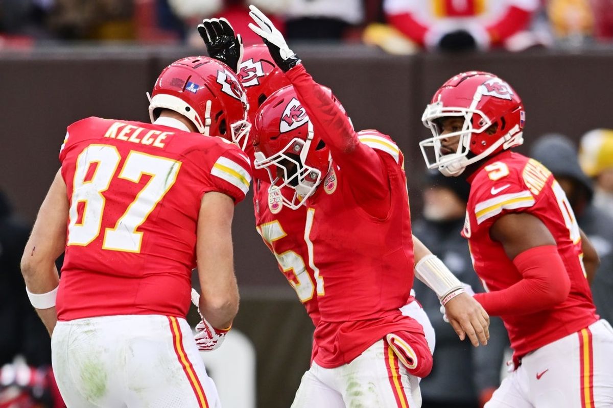 Dec 15, 2024; Cleveland, Ohio, USA; Kansas City Chiefs wide receiver Xavier Worthy (1) celebrates with tight end Travis Kelce (87) and wide receiver JuJu Smith-Schuster (9) after scoring a touchdown during the second half against the Cleveland Browns at Huntington Bank Field. Mandatory Credit: Ken Blaze-Imagn Images