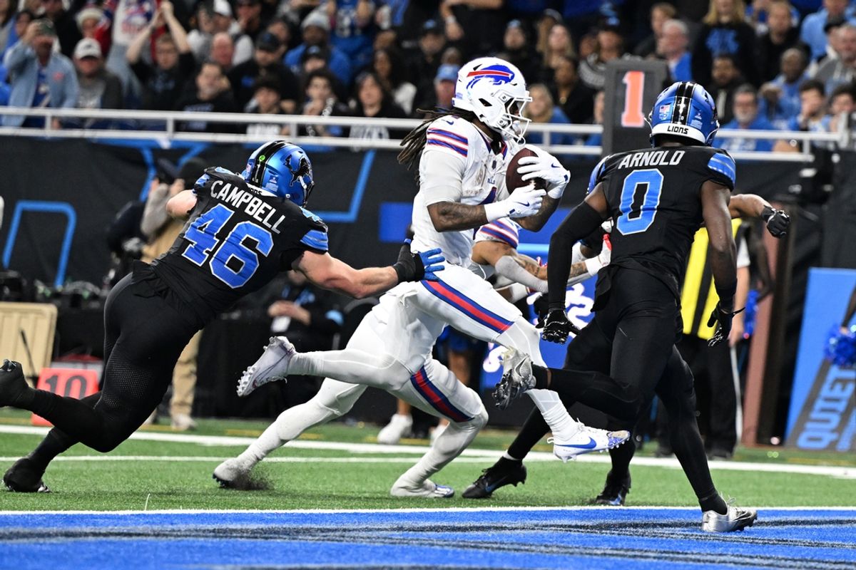 Dec 15, 2024; Detroit, Michigan, USA; Buffalo Bills running back James Cook (4) runs for a touchdown against the Detroit Lions in the second quarter at Ford Field. Mandatory Credit: Lon Horwedel-Imagn Images