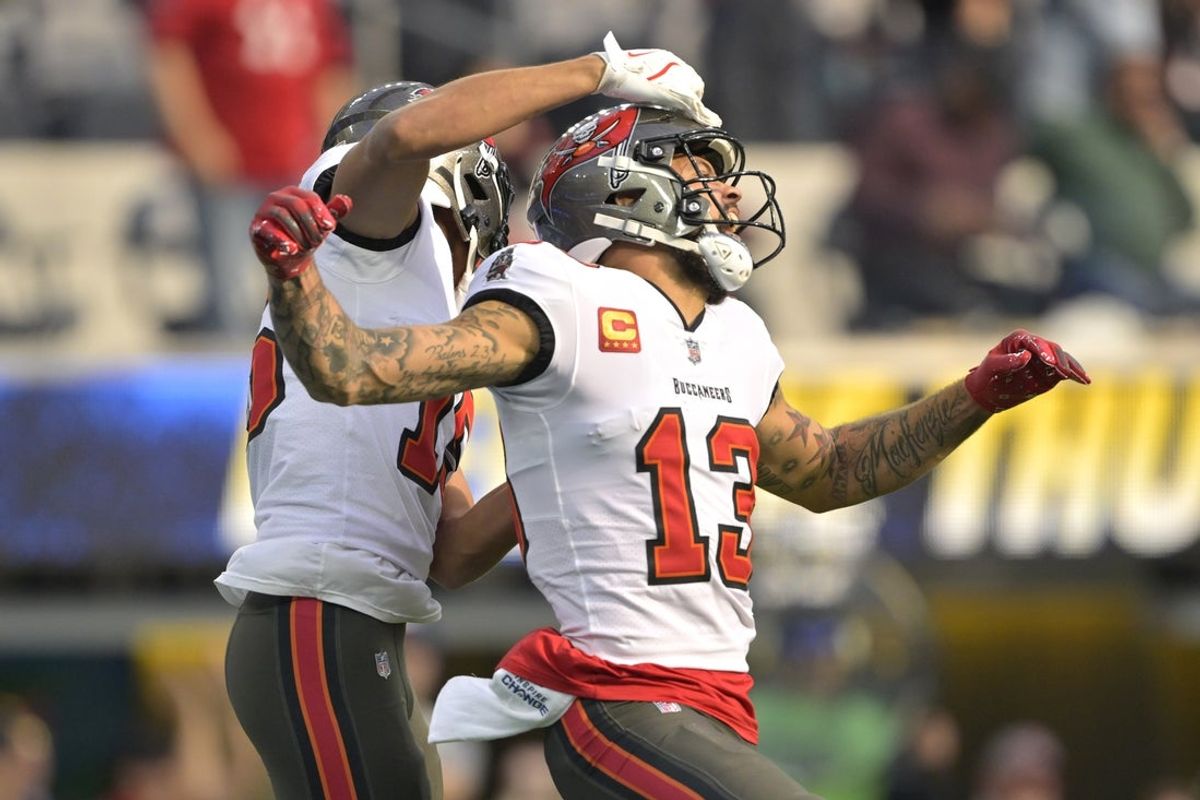 Dec 15, 2024; Inglewood, California, USA;  Tampa Bay Buccaneers wide receiver Mike Evans (13) celebrates with wide receiver Jalen McMillan (15) after a touchdown in the first half against the Los Angeles Chargers at SoFi Stadium. Mandatory Credit: Jayne Kamin-Oncea-Imagn Images