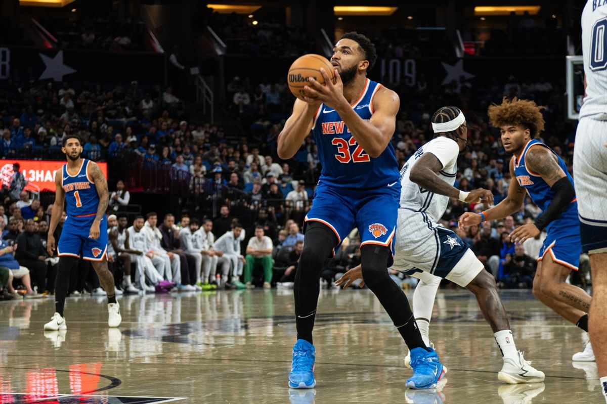 Dec 15, 2024; Orlando, Florida, USA; New York Knicks center Karl-Anthony Towns (32) shoots the ball against the Orlando Magic  in the second quarter at Kia Center. Mandatory Credit: Jeremy Reper-Imagn Images