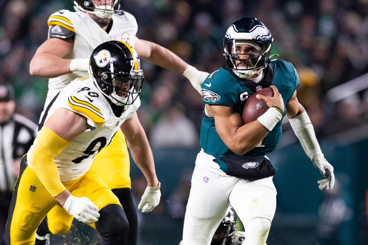 Dec 15, 2024; Philadelphia, Pennsylvania, USA; Philadelphia Eagles quarterback Jalen Hurts (1) runs with the ball in front of Pittsburgh Steelers linebacker T.J. Watt (90) during the third quarter at Lincoln Financial Field. Mandatory Credit: Bill Streicher-Imagn Images