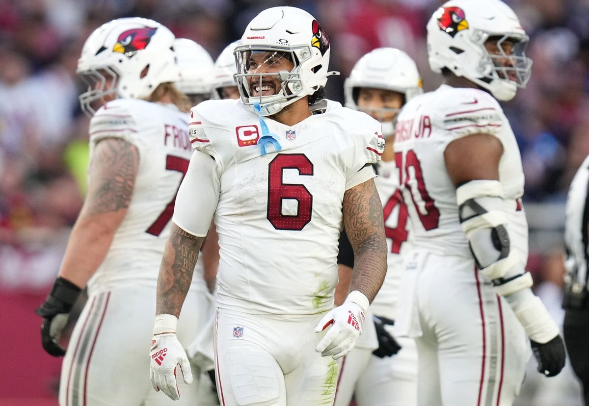 Arizona Cardinals running back James Conner (6) smiles as he comes out the huddle during their game against the New England Patriots at State Farm Stadium on Dec 15, 2024.
