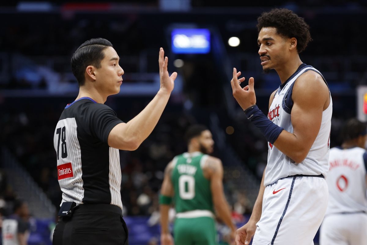 Dec 15, 2024; Washington, District of Columbia, USA; Washington Wizards guard Jordan Poole (13) argues a call with referee Evan Scott (78) against the Boston Celtics in the third quarter at Capital One Arena. Mandatory Credit: Geoff Burke-Imagn Images