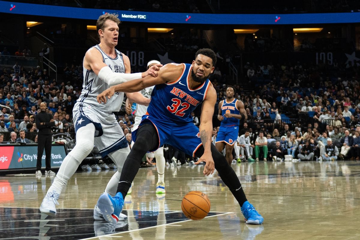 Dec 15, 2024; Orlando, Florida, USA; New York Knicks center Karl-Anthony Towns (32) dribbles the ball against Orlando Magic forward Moritz Wagner (21) in the second quarter at Kia Center. Mandatory Credit: Jeremy Reper-Imagn Images