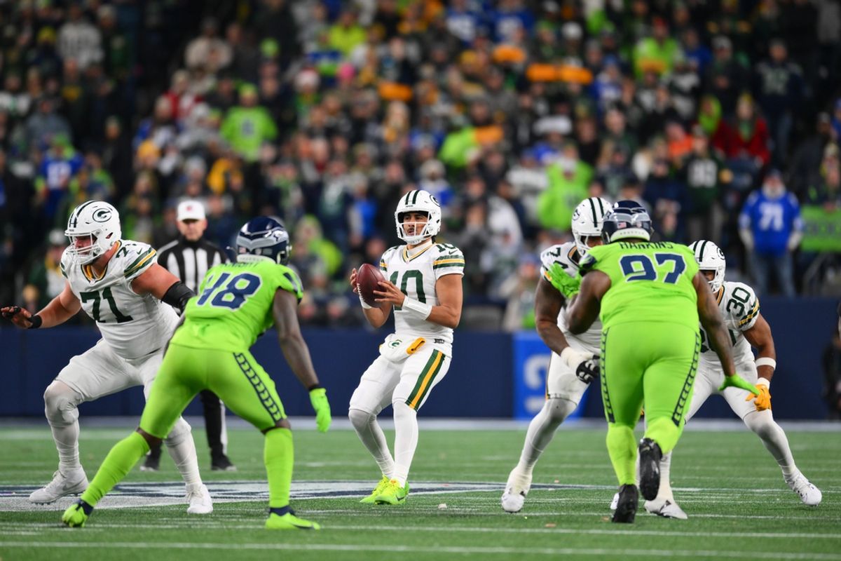 Dec 15, 2024; Seattle, Washington, USA; Green Bay Packers quarterback Jordan Love (10) looks to pass the ball against the Seattle Seahawks during the first half at Lumen Field. Mandatory Credit: Steven Bisig-Imagn Images
