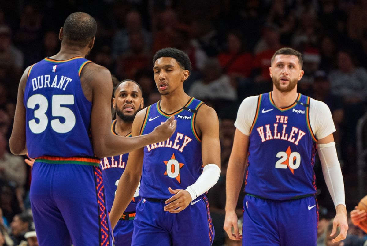 Dec 15, 2024; Phoenix, Arizona, USA;  Phoenix Suns forward Kevin Durant (35) with teammates forward Ryan Dunn (0), center Jusuf Nurkic (20) and point guard Monte Morris (23) in the second half during a game against the Portland Trail Blazers at Footprint Center. Mandatory Credit: Allan Henry-Imagn Images