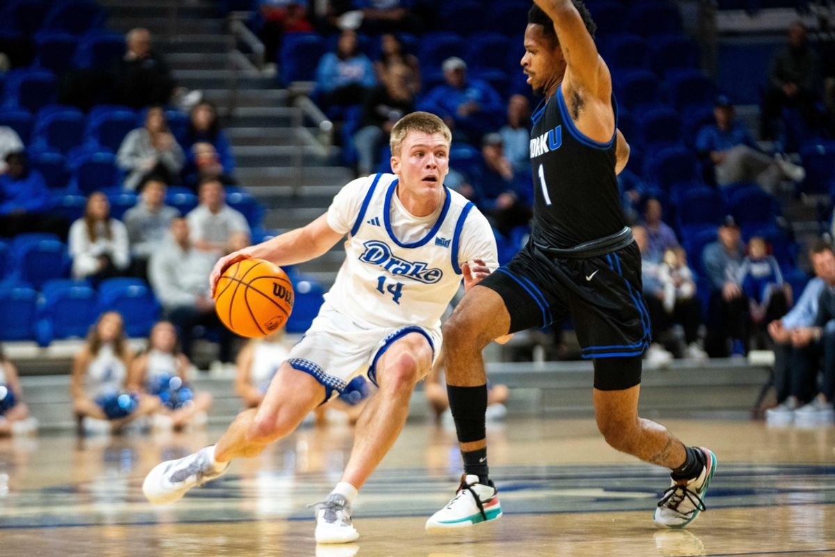 Drake's Bennett Stirtz (14) drives past his defender on Monday, Nov. 4, 2024, at the Knapp Center.