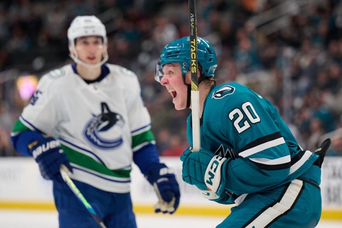 Nov 25, 2023; San Jose, California, USA; San Jose Sharks left wing Fabian Zetterlund (20) reacts after scoring a goal against the Vancouver Canucks during the second period at SAP Center at San Jose.