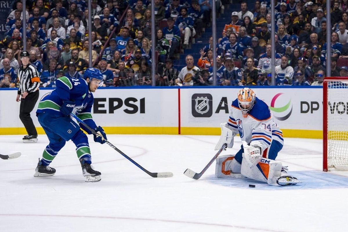 May 10, 2024; Vancouver, British Columbia, CAN; Edmonton Oilers goalie Stuart Skinner (74) makes a save on Vancouver Canucks forward Pius Suter (24) during the first period in game two of the second round of the 2024 Stanley Cup Playoffs at Rogers Arena.