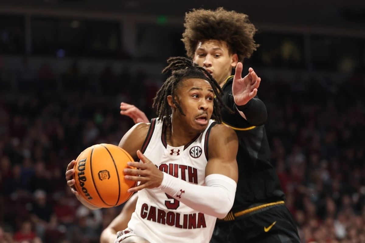 Jan 27, 2024; Columbia, South Carolina, USA; South Carolina Gamecocks guard Meechie Johnson (5) drives around Missouri Tigers forward Jordan Butler (0) in the first half at Colonial Life Arena.