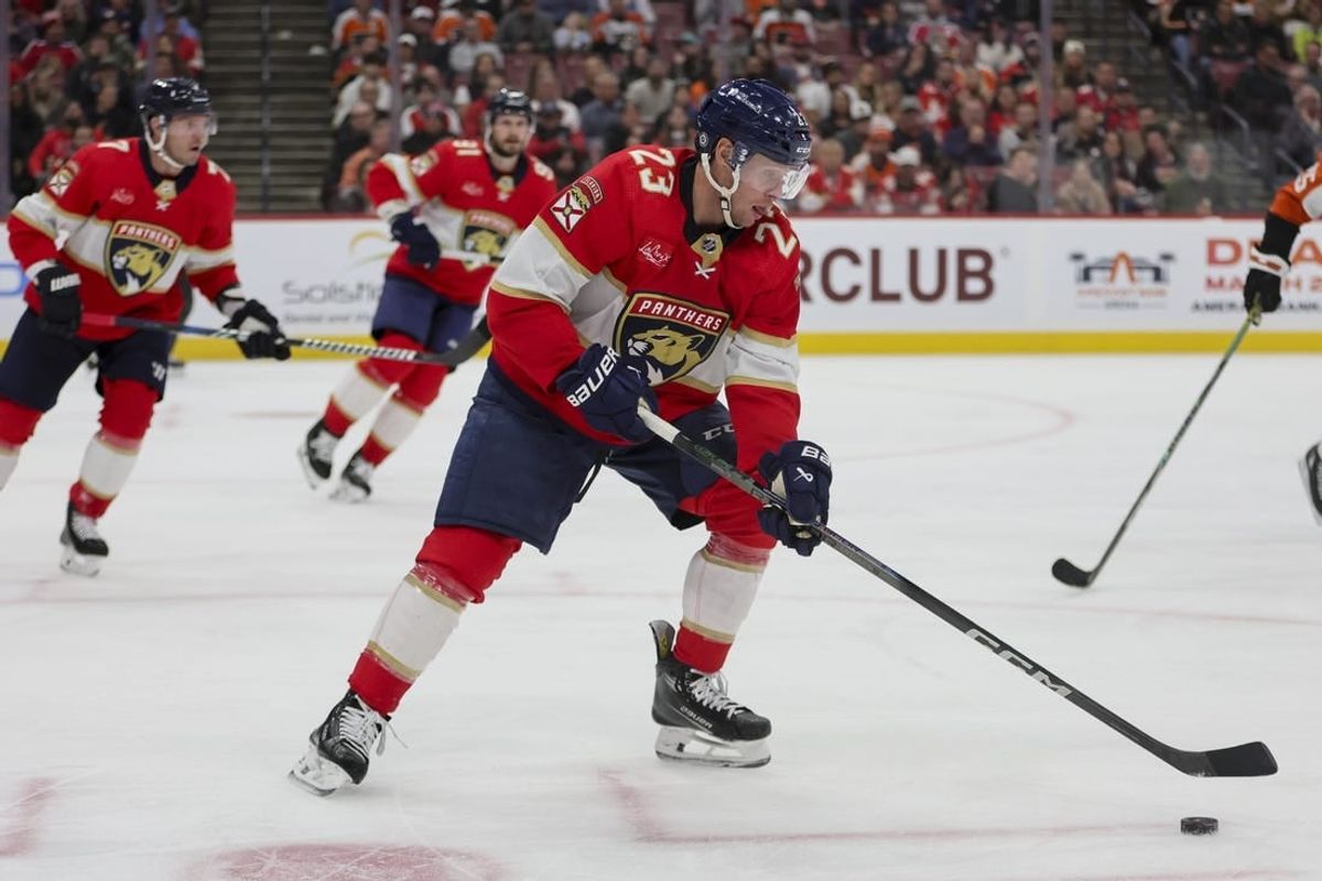 Feb 6, 2024; Sunrise, Florida, USA; Florida Panthers center Carter Verhaeghe (23) moves the puck against the Philadelphia Flyers during the third period at Amerant Bank Arena.