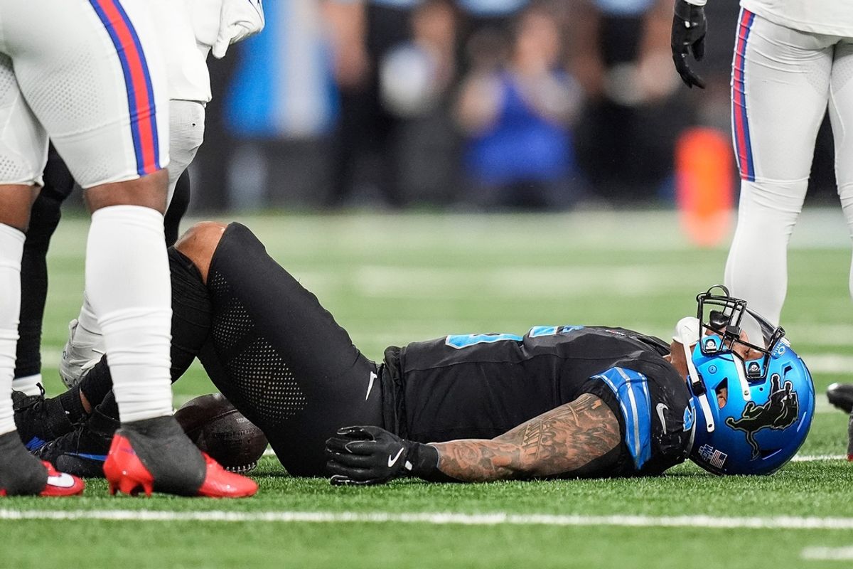 Detroit Lions running back David Montgomery (5) lays on the field after a play against the Buffalo Bills during the first half at Ford Field in Detroit on Sunday, Dec. 15, 2024.