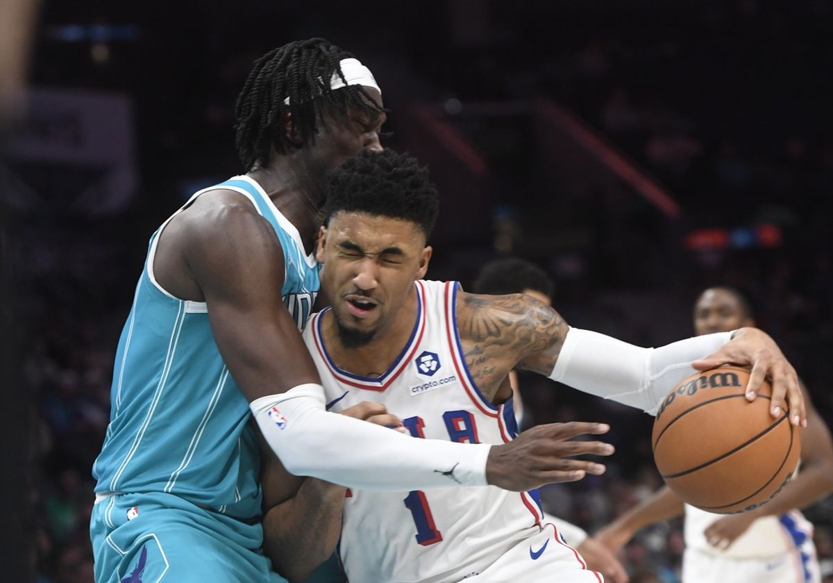 Dec 16, 2024; Charlotte, North Carolina, USA;  Philadelphia 76ers forward KJ Martin (1) collides with Charlotte Hornets center Mark Williams (5) during the first half at the Spectrum Center. Mandatory Credit: Sam Sharpe-Imagn Images